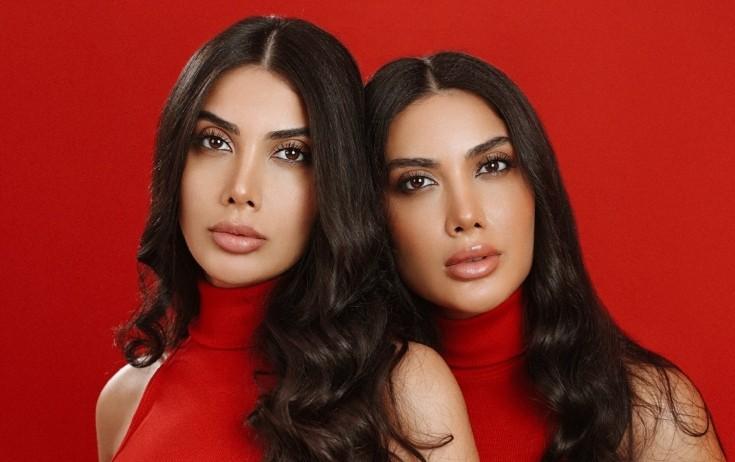 Əkiz bacılar aparat masajları edir